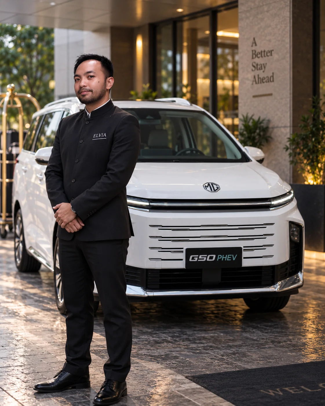 ELvia chauffeur waiting beside the white MG G50 PHEV
